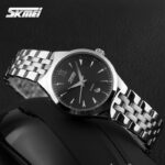 ساعت مچی عقربه‌ای مردانه کوارتز اسکمی مدل 9071 کد 08 - تصویر 5